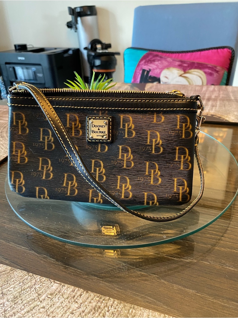 Dooney & Bourke Black and Gold Logo Wristlet